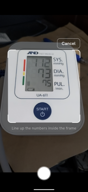 Camera scanning a blood pressure monitor